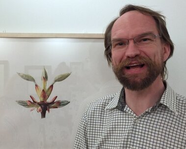 Martin Allen with his painting of horse chestnut buds at the 'British Artists in the Shirley Sherwood Collection' exhibition at Kew in 2016