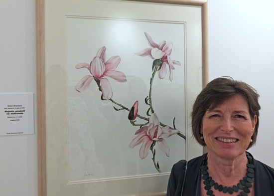 Siriol Sherlock with her painting of 'Magnolia campbellii subsp. mollicomata' 